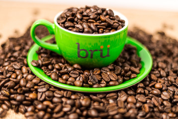 Brown roasted coffee beans, seed on dark background. Espresso dark, aroma, black caffeine drink. Closeup isolated energy mocha, cappuccino ingredient.