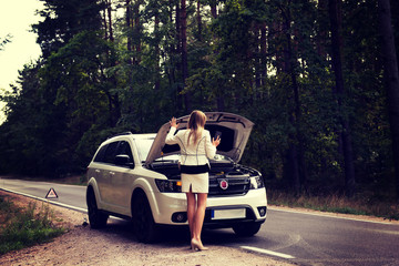 Wall Mural - Woman opened the hood broken car