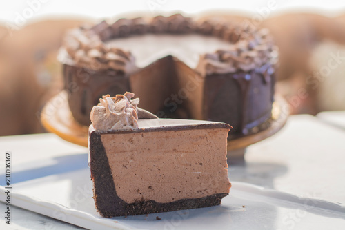 Fotografie, Obraz Mocha cheesecake with chocolate and coffee whipped cream on top