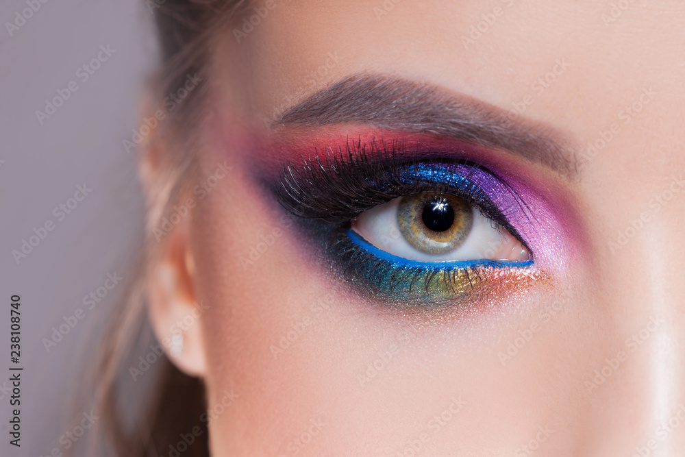 Amazing Bright eye makeup in luxurious blue shades. Pink and blue color, colored eyeshadow - obrazy, fototapety, plakaty 