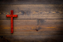 Funeral Concept. Wooden Cross On Dark Wooden Background Top View Copy Space