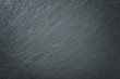 © nikol85 - Dark gray background of natural slate. Texture black stone closeup.