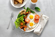 © kucherav - Breakfast table Breakfast plate fried eggs vegetables mushrooms toast top view healthy table
