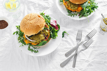 Vegetarian burger pumpkin cutlet spinach arugula pesto top view Healthy food