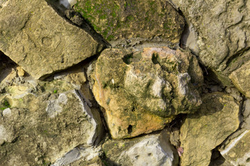 the old wall of natural stone close-up