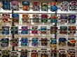 © marmoset - Sport equipment background. Colored snowboard masks in a rows on a showcase. Colorful ski masks on the shop window in the sports shop.