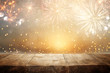 © tomertu - Empty wooden table in front of fireworks background. Product display montage.