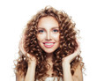 © artmim - Happy woman smiling and touching her hair her hand isolated on white. Haircare concept