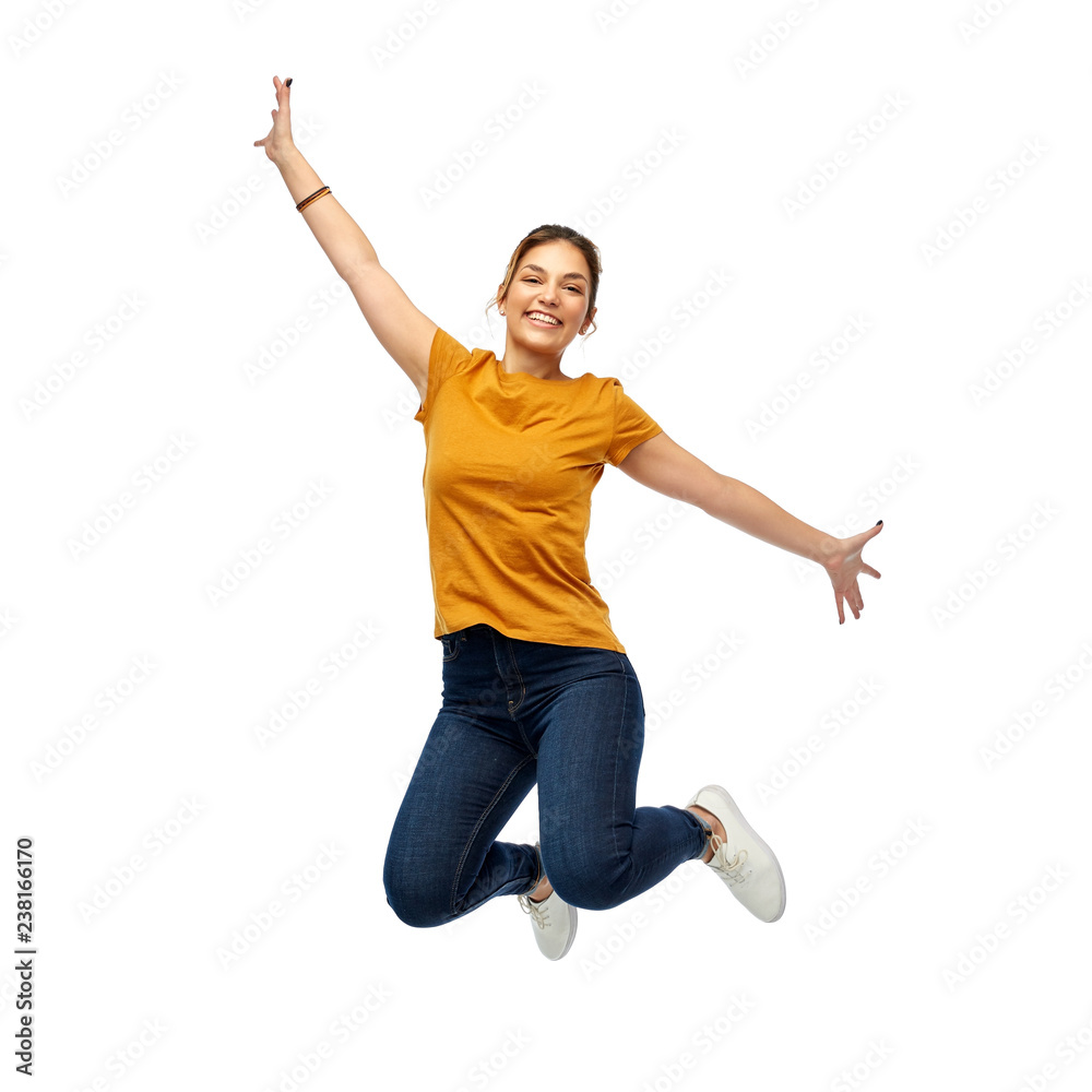 Obraz motion, freedom and people concept - happy young woman or teenage girl jumping over white background fototapeta, plakat