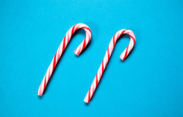 red candy canes on blue - Christmas sweets