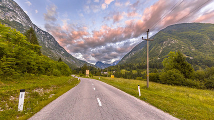 Wall Mural - Road through mountain  landscape in Julian Alps