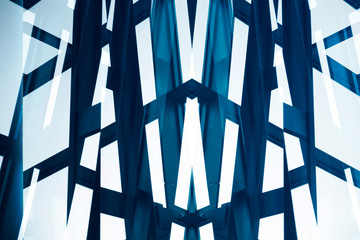 Poster - Steel and glass structure of an office building exterior fragment with metal framework. Abstract angular modern architecture background.