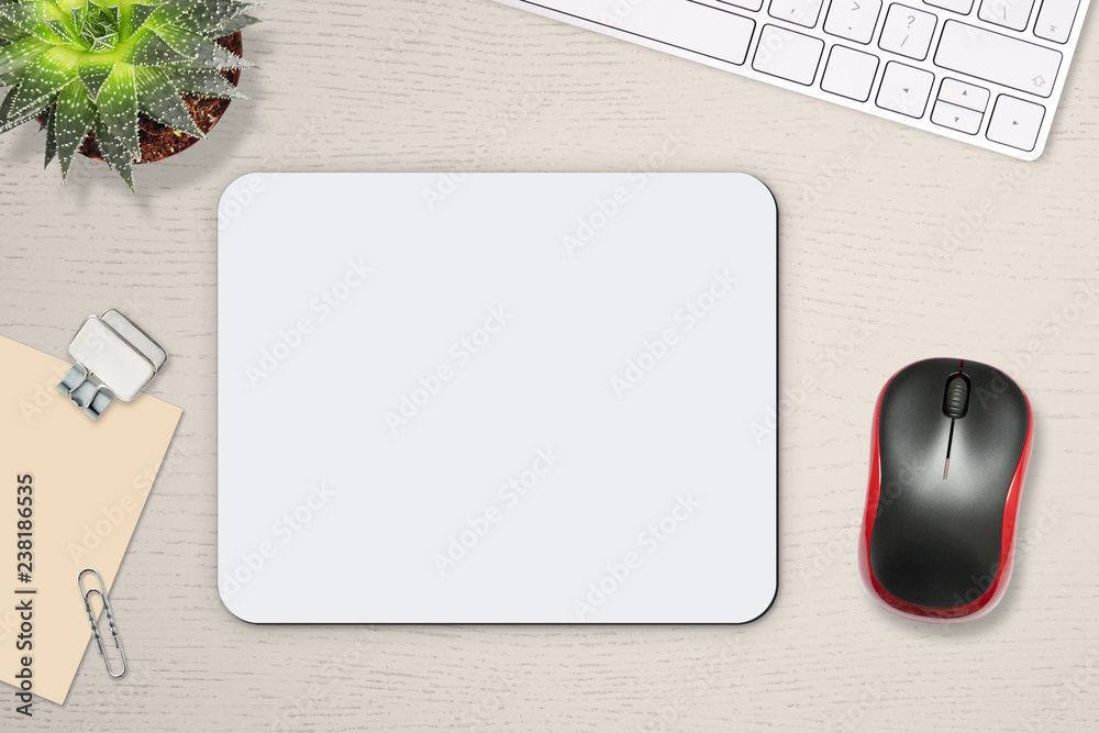 Mouse pad mockup. White mat on the table with props, mouse and keyboard - obrazy, fototapety, plakaty 