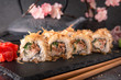 © Екатерина - Salmon Sushi Roll In Tuna Flakes Sushi menu. Japanese food.