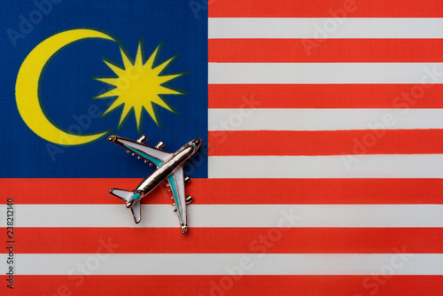 Fotografía Plane over the flag of Malaysia, the concept of journey.