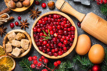 Wall Mural - Christmas food baking background top view on black background.