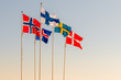 Danish, Swedish, Icelandic, Finnish and Norwegian scandinavian flags waving on the wind in Helsinborg, Sweden