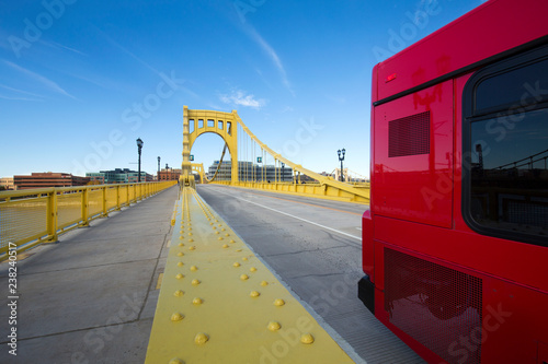 Red bus crossing the Andy Warhol Bridge in Pittsburgh, Pennsylvania Slika na platnu