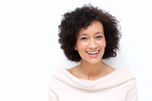 Close Up Attractive Middle Age African American Woman Smiling Against White Background