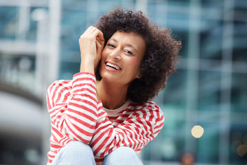 Wall Mural - happy african american woman laughing outdoors