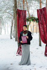 Wedding ceremony for two near the red arch