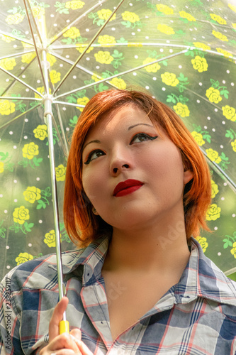 Beautiful Short Haired Young Woman With A Umbrella Outdoors