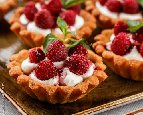 Fotomural Fruit tart with raspberries and cream, cakes and sweetness on holiday background