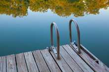 Wooden Dock With Ladder On The Lake