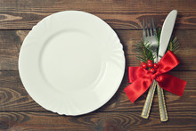 Christmas Table Setting. Empty Christmas Plate And Cutlery