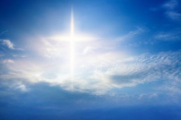 Heavenly Cross . Religion symbol shape .  Dramatic nature background  . Glowing cross in sky . Happy Easter. Light from sky . Religion background .  Paradise heaven . Light in sky .  