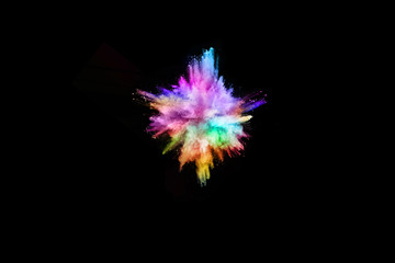 Multicolor powder explosion on black background. 