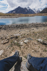 Wall Mural - a man enjoying beautiful mountain land lake landscape in northern india. travel lifestyle and advent