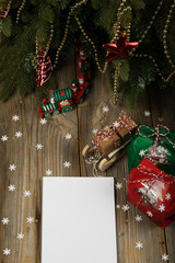 Blank sheet of paper on a new year's background. , Blank sheet of paper and Christmas present on a new year's background.