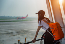 Woman Traveler Passenger Delay And Lost Of Flight Looking At The Aircraft Run Away In Runway With Disappointed And Upset On Missed The Flight