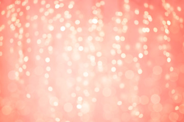 Wall Mural - holidays and design concept - blurred bokeh lights in living coral, color of the year 2019