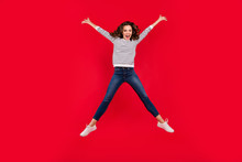 Full Length Size Body Photo Of Jumping High Charming She Her Girl Legs And Hands Apart In Shape Figure Of Star Glad To Win Wearing White Striped Casual Sweater On Red Vivid Bright Background