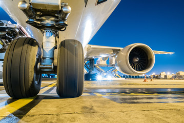 loading cargo outside cargo plane at twilight sky