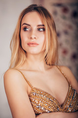 Sticker - Close-up of glamorous portrait of sexy blonde woman in Golden dress. Beautiful girl looking to the side