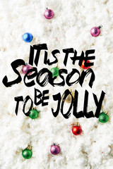 Wall Mural - top view of colorful christmas toys on white cotton wool background with 