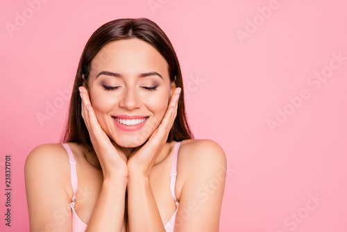 Fotografía Close up portrait of tender cute gorgeous touching cheeks with delight about sm