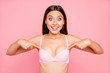 © deagreez - Close up portrait of attractive beautiful delighted gorgeous skinny her she girl showing nice proportions of decollete cleavage in push up bra isolated on pink background