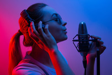 Music, Show Business, People And The Voice Of A Singer Or DJ With Headphones With Glasses And A Microphone Singing A Song In The Recording Studio. Discoteka, Party, Light-music, Party, Party, Party