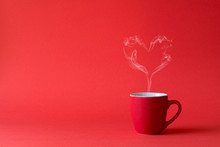 Cup Of Tea Or Coffee With Steam In One Heart Shape On Red Background. Valentine's Day Celebration Or Love Concept. Copy Space