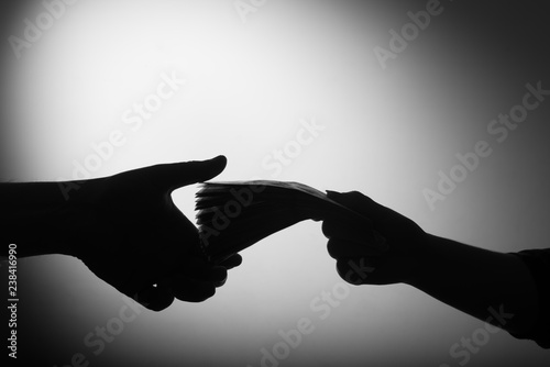 Fotomural dark economy. Two hands with money