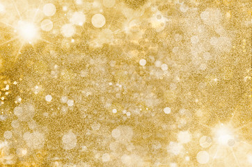 Wall Mural - gold glitter background. golden bright, warm light flares and mist