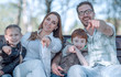 © ASDF - close up.happy family pointing at you