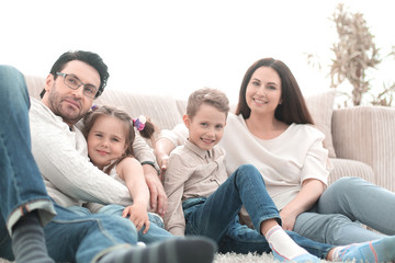 Wall Mural - happy family rests in the living room on a free evening