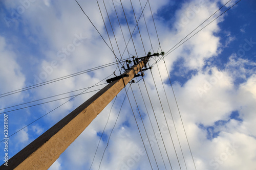 Fotografie, Obraz Electric pole with wires against the sky
