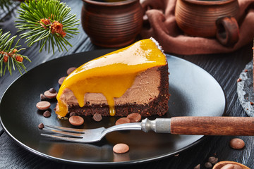 Canvas Print - a piece of a chocolate mango cheesecake