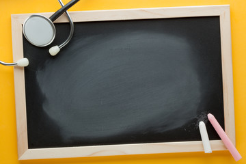 Blank blackboard and stethoscope